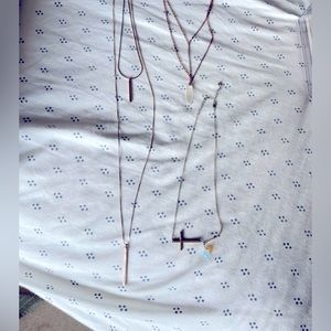 Bundle of unique, layered necklaces.